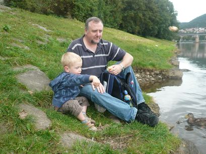 Showing Dad how to feed the ducks.