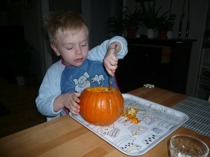 Carving a pumpkin for Halloween. (Mummy helped.) 