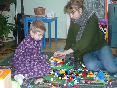 Ian building things with his sister. 