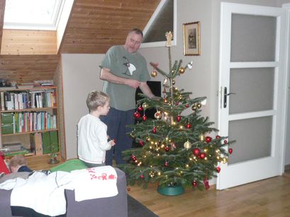 The boys decorating the tree.