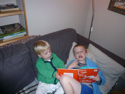 Ian reading to his brother. 